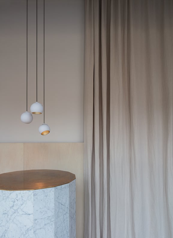 White pendant lighting above counter top