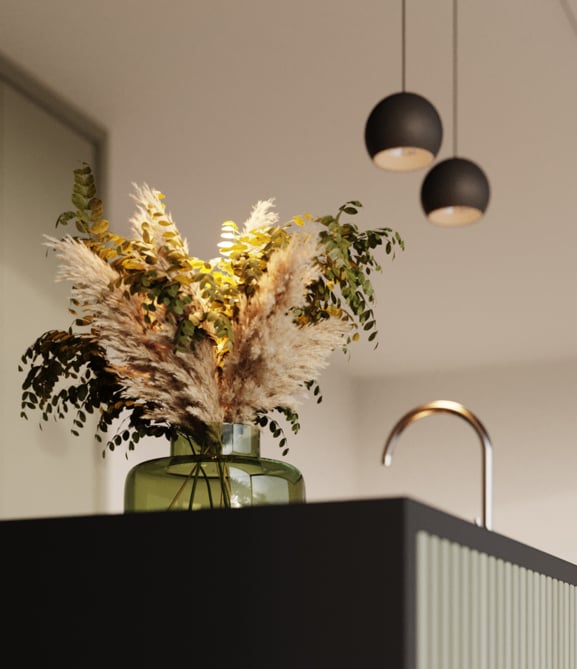 Pendant lighting above green kitchen counter top