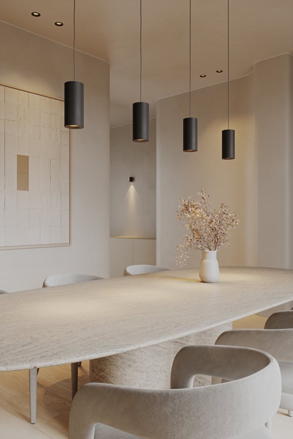 Cylinder-shaped pendant lighting above dining table