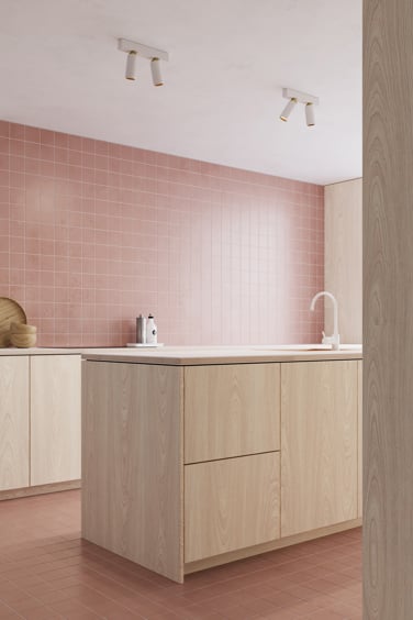 Modern white luminaire in a pink kitchen