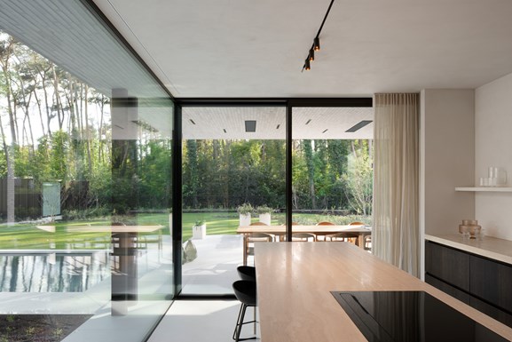 Modern kitchen with linear lighting and surface downlighters