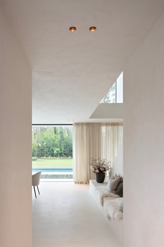 Minimalistic living room with bronze recessed downlighters